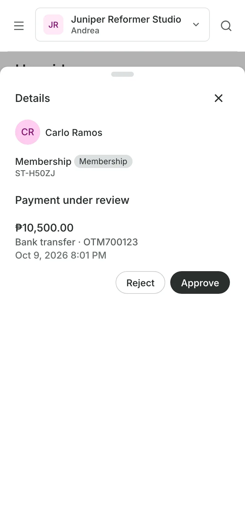 A bank transfer receipt open on a phone, with Approve and Reject