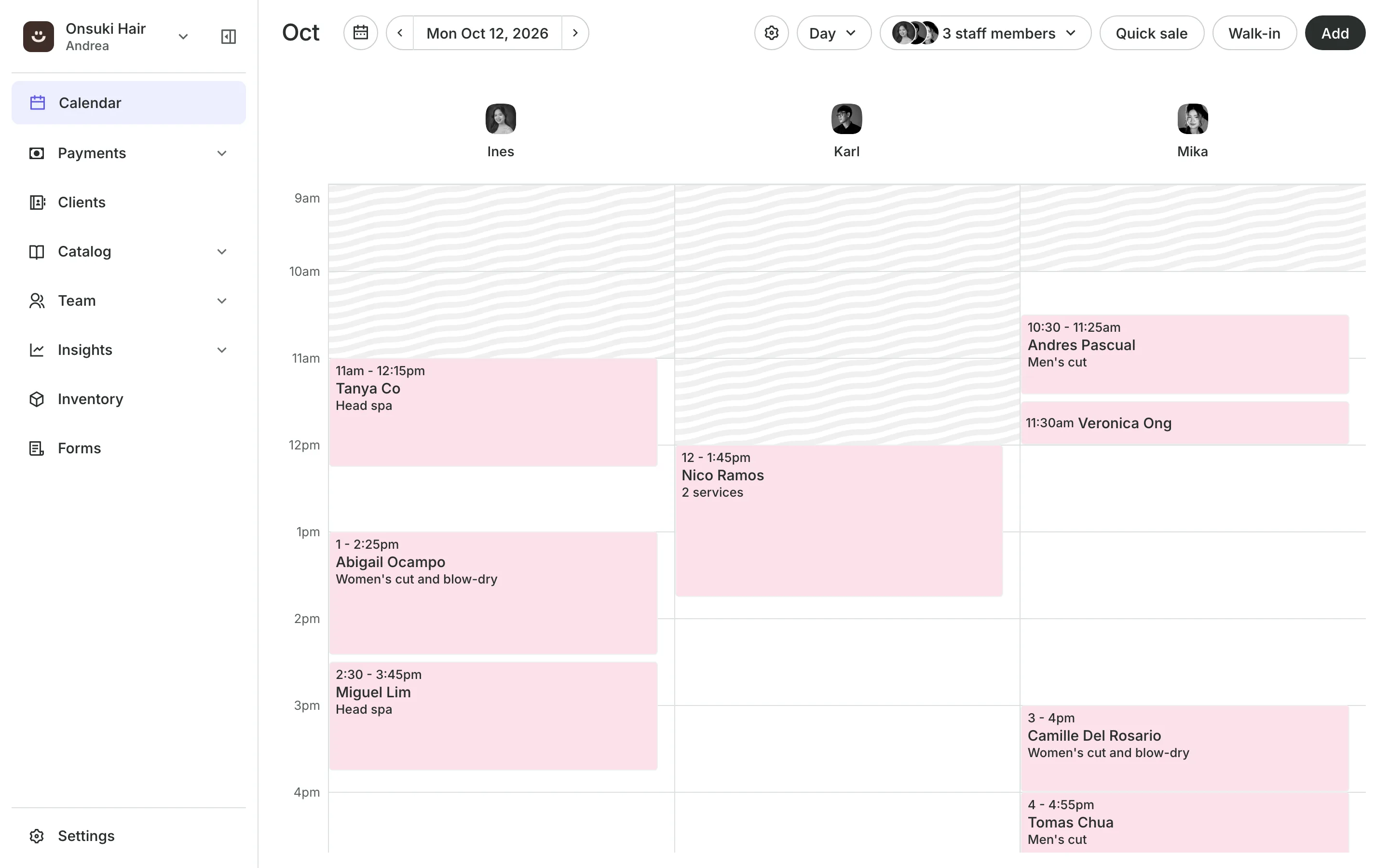 The calendar in day view: three staff columns with each client's appointment and service