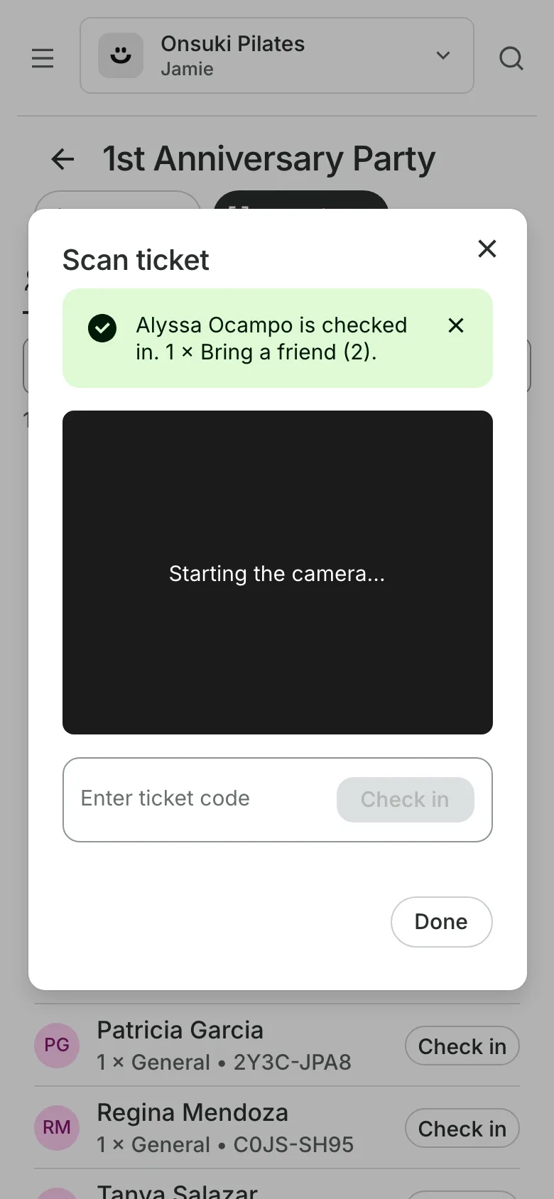 Checking a ticket in at the door on a phone: the ticket scanned and the guest checked in
