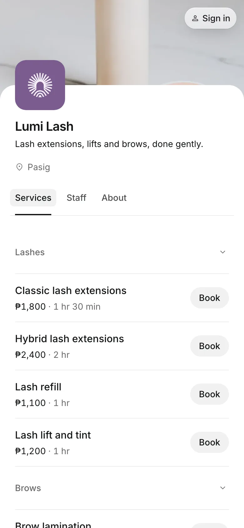 The business's booking page on a phone